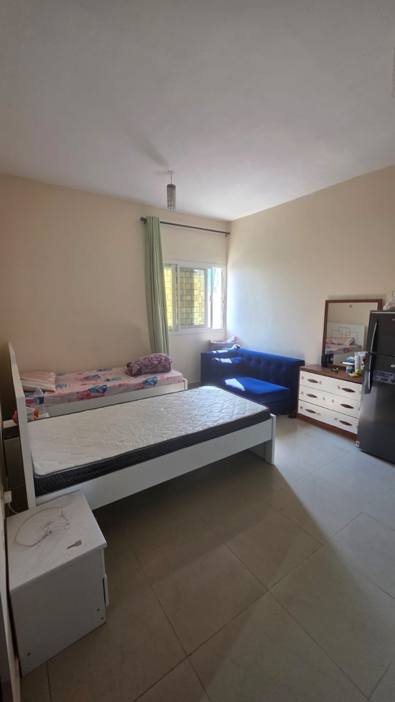 Double master bedroom in a clean girls' apartment