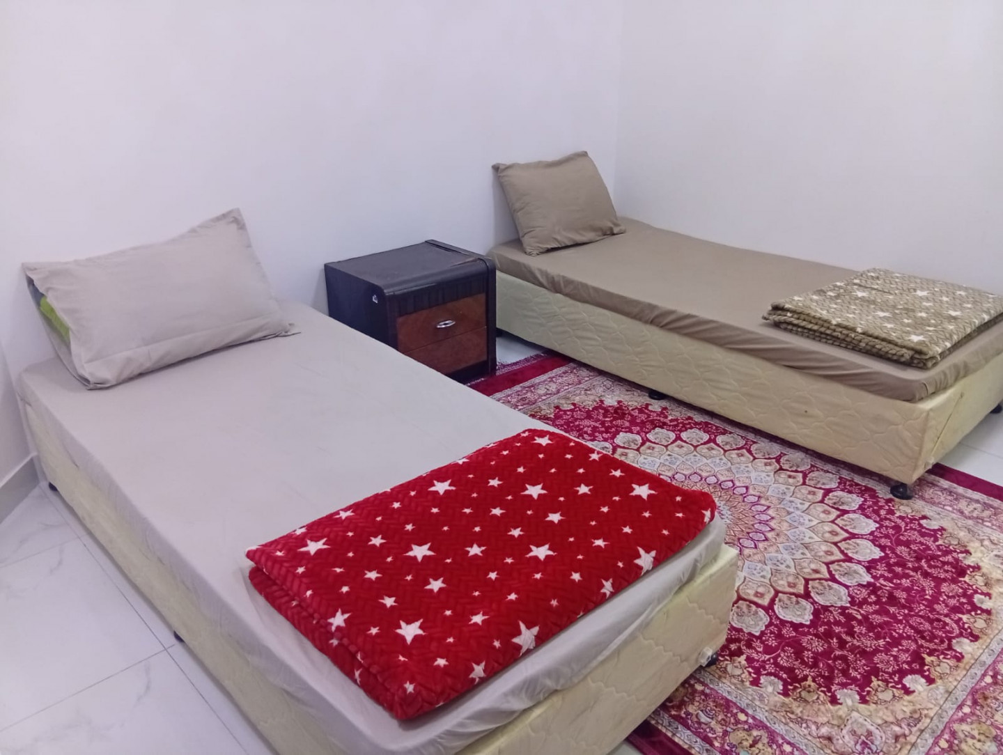 Daily and monthly rentals of shared accommodation for young men on Al Maha Main Street, including all services and bills.
